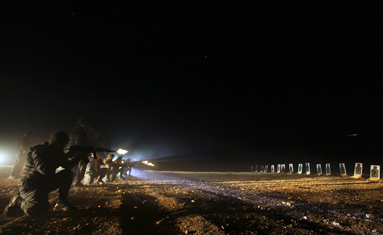 24 hours in pictures: Afghan police recruits at a firing range 