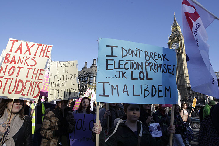 Students and slogans: Students with placards outside Parliament
