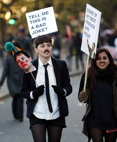 Students and slogans: Tell Me This a Bad Joke? placard
