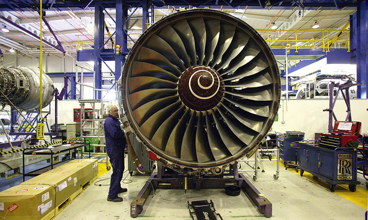Week in Business: A Rolls-Royce engineer works on a Trent Jet engine at their