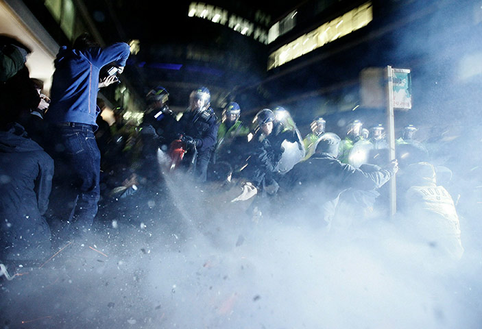 24 hours in picturesoade: Police move in on protestors outside the Conservative Party headquarters