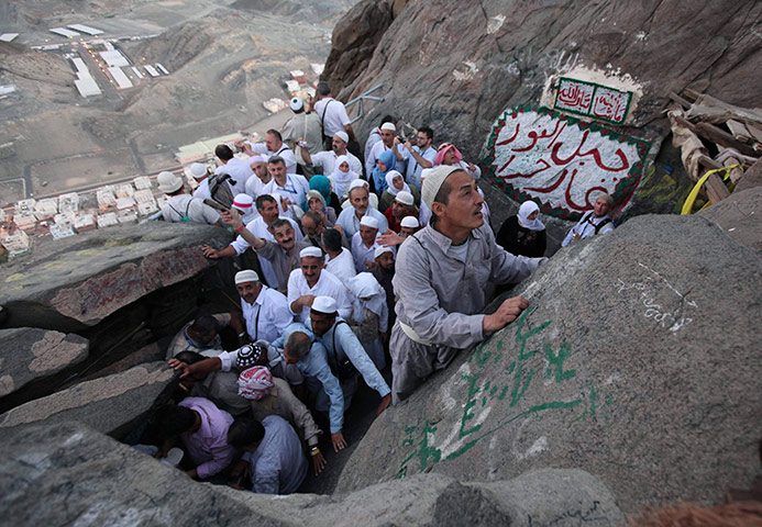 24 hours in pictures: Muslim pilgrims make their way to Hera cave on Mount Al-Noor during haj