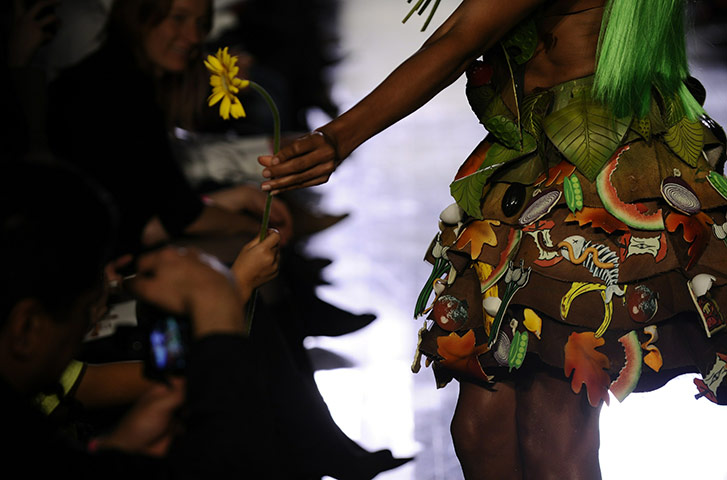 24 hours in pictures: A fashion model displays an outfit made of chocolate