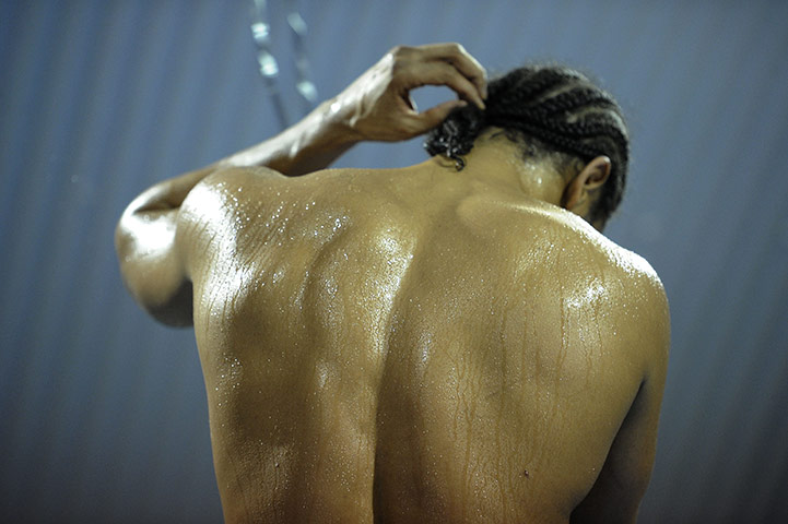 Haye v Harrison: David Haye skips in the ring while adjusting the clip on his pony-tail