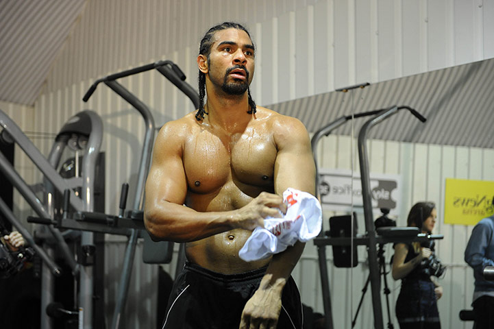 Haye v Harrison: David Haye towel shimself down with a t-shirt after lifting some weights