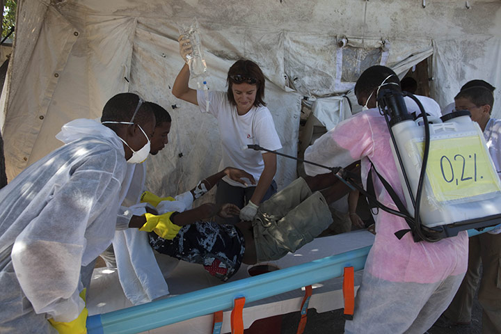 Cholera in Haiti: A patient suffering from cholera receives treatment in Port-au-Prince