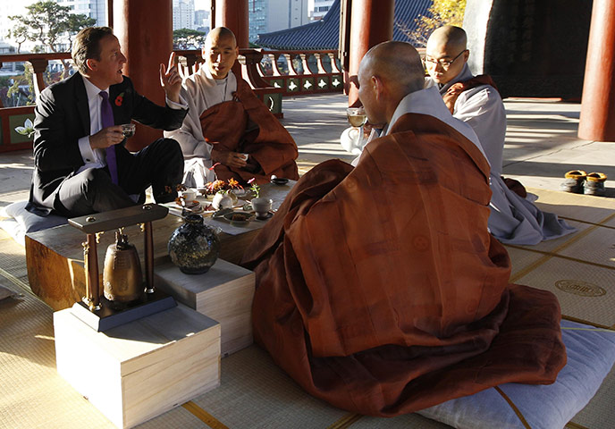 G20 Summit Update: David Cameron drinks tea with monks at the Bongeunsa temple in Seoul