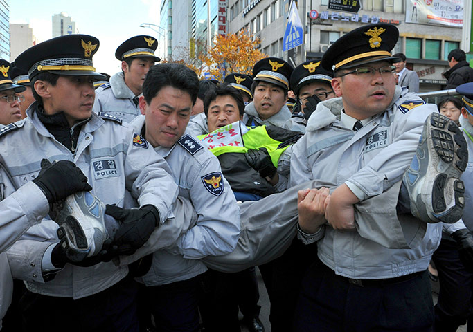 G20 Summit Update: South Korean police remove a protestor from a French company in Seoul G20