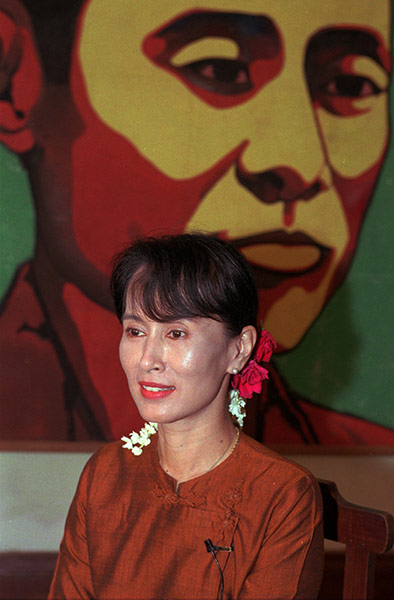 Aung San Suu Kyi release: 1996: Aung San Suu Kyi with a portrait of her father, General Aung San