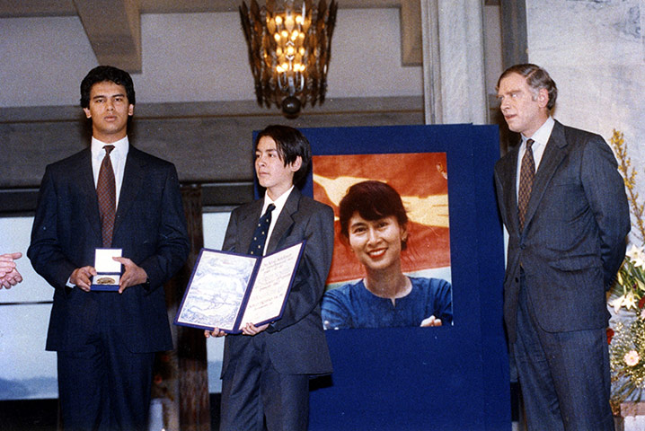 Aung San Suu Kyi was awarded a Nobel Peace Prize which was collected on her behalf by her two sons and husband Aung San Suu Kyi was awarded a Nobel Peace Prize which was collected on her behalf by her two sons and husband