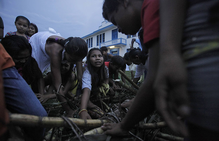 From the agencies: Children fight for fruit during a ceremony in Santa Isabel do Rio Negro