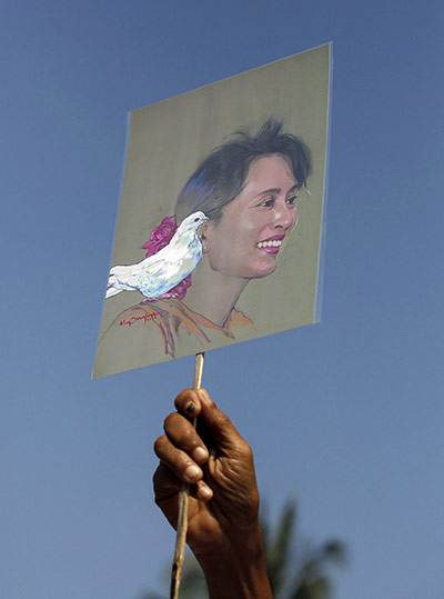 Suu Kyi Release: A National League for Democracy member with a sketch of Aung San Suu Kyi