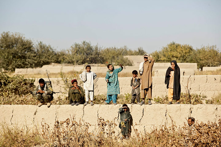 101st Airborne: Local villagers watch as he US Army recovers supply drops