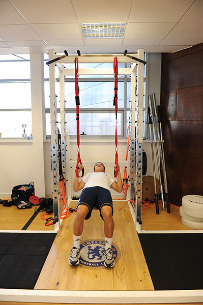 Chelsea Academy: A member of the Academy team works on his upper body strength in the gym
