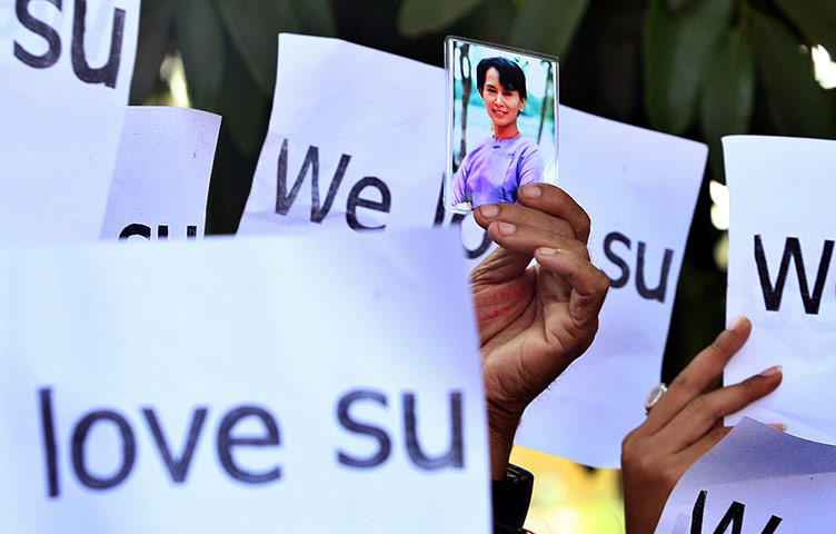 Aung San Suu Kyi release : Supporters hold up a pictures and signs of Aung San Suu Kyi 