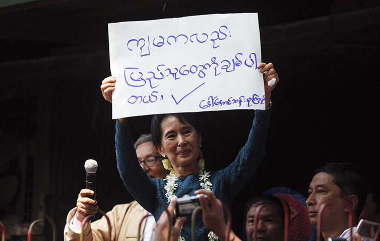 Aung San Suu Kyi release : Aung San Suu Kyi holds a sign in Yangon