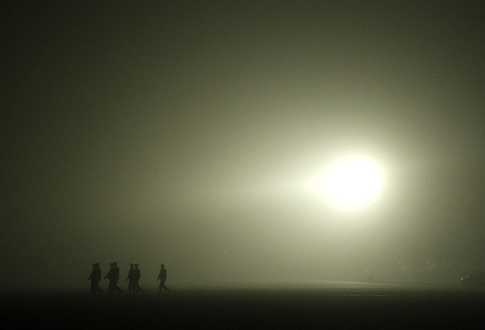 24 hours in pictures: body of US soldier arrives home from afghanistan