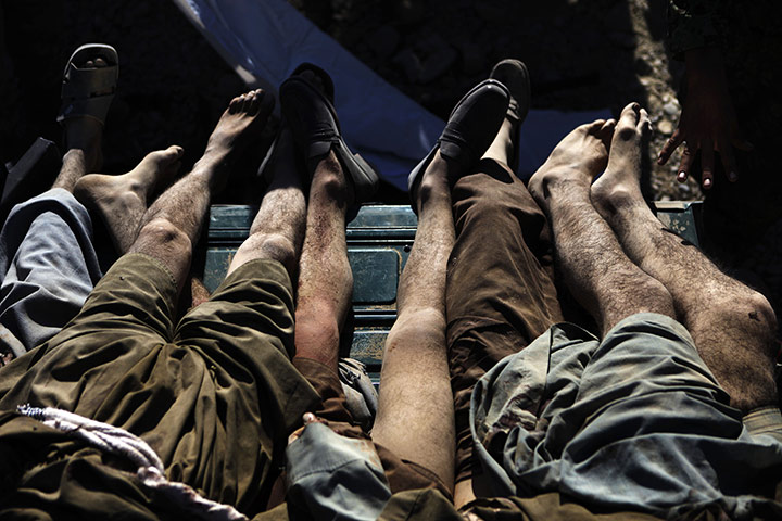 24 hours in pictures: The bodies of Taliban fighters in Helmand province