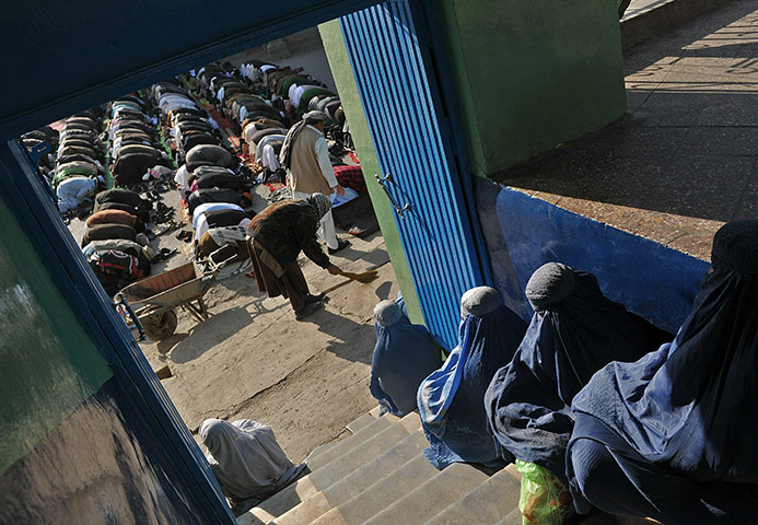 Eid al-Adha: Afghan women wait for the start of Eid al-Adha prayers