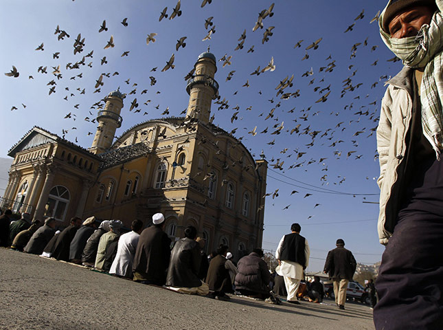 Eid al-Adha: Afghan men wait to perform Eid al-Adha prayers at a mosque in Kabul 