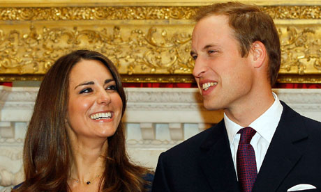 Prince William and his fiancee Kate Middleton pose for the media