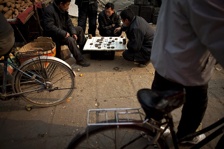 24 hours in pictures: Beijing, China: Vegetable vendors