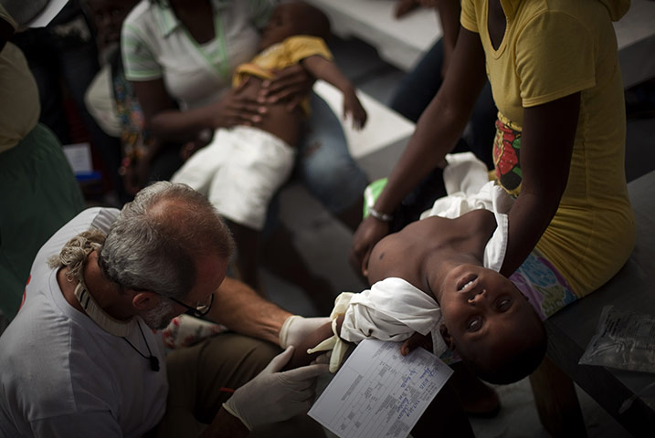 24 hours in pictures: cholera victim in haiti