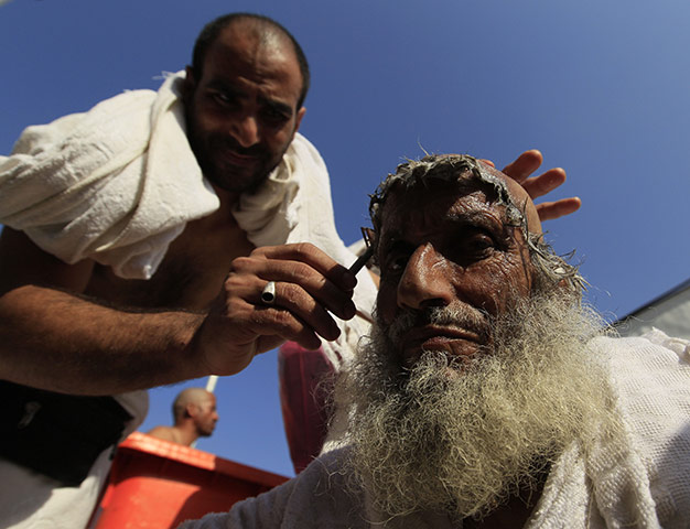 Eid al-Adha: A Muslim pilgrim has his head shaved