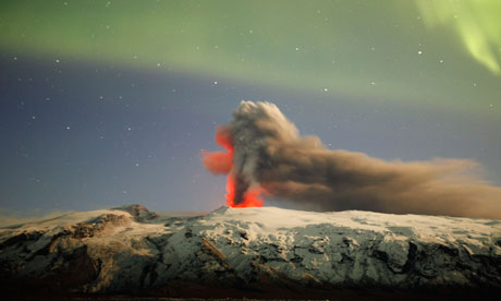 Northern lights illuminate the plume of ash above Eyjafjallajökull