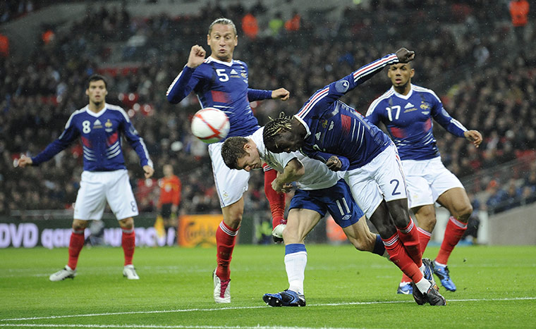 England v France: Sagna gets down fastest to beat Milner to the ball