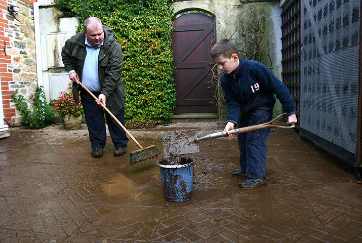 Cornwall Floods Update: Rob and Edward Rusbridge, clean up after flooding in Lostwithiel, Cornwall