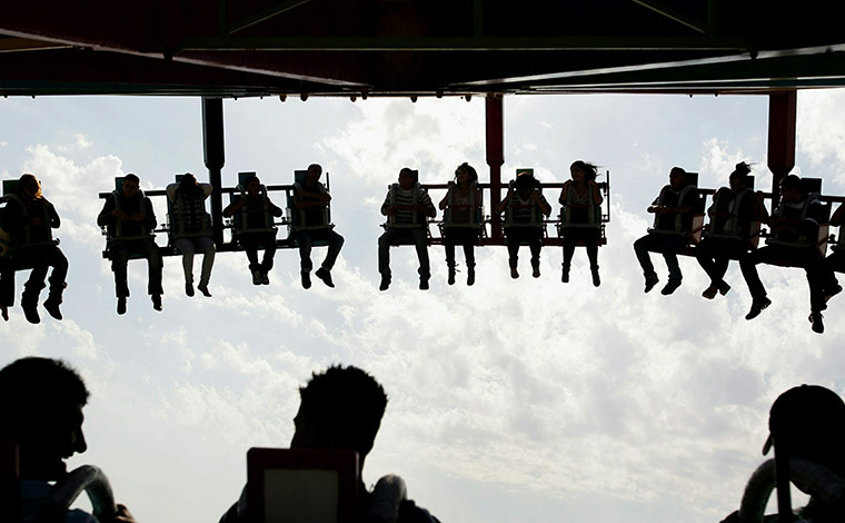 24 hours in pictures: Palestinians enjoy a ride at an amusement park, Jenin
