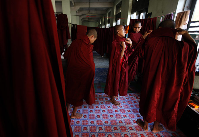24 hours in pictures: Buddhist monks prepare to walk the streets collecting alms, Burma