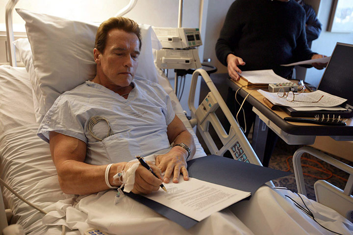 Arnold Schwarzenegger : Arnold Schwarzenegger works from his hospital bed in Los Angeles 2006