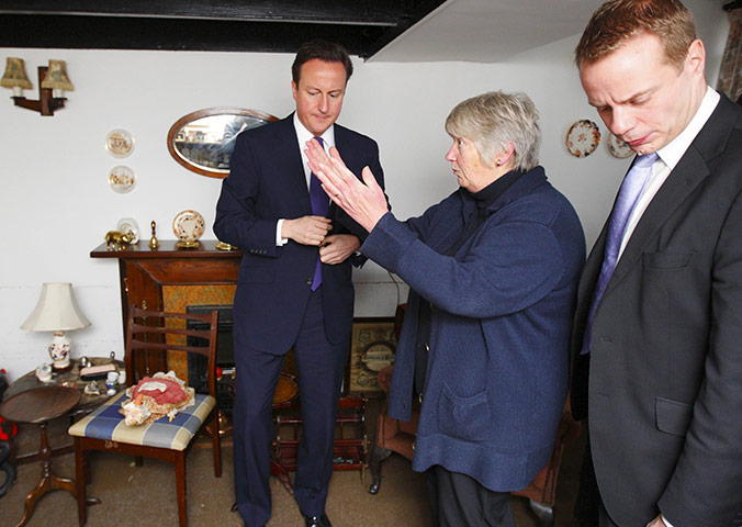 Cameron Visit Cornwall: David Cameron and local MP Steven Gilbert talk with Val Paige in her home