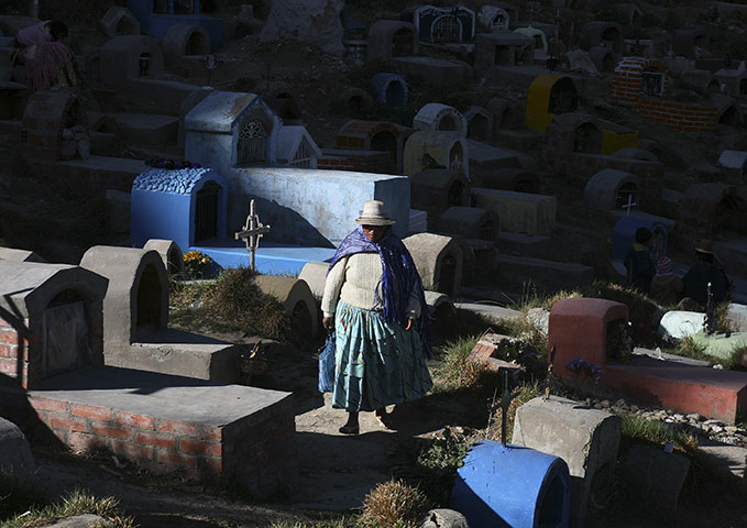 All Saints: A woman walks at the 