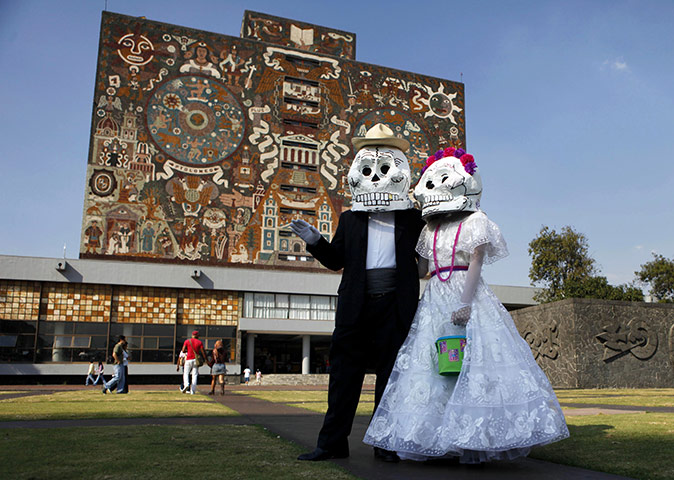All Saints: Mexico City, Mexico: A couple wear oversized skull