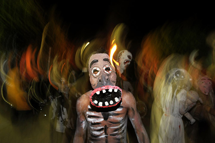 All Saints:  Young revellers take part in a parade called 