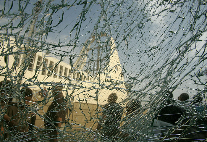 24 hours pics: People gather near the destruction of the Syrian Catholic church, Baghdad