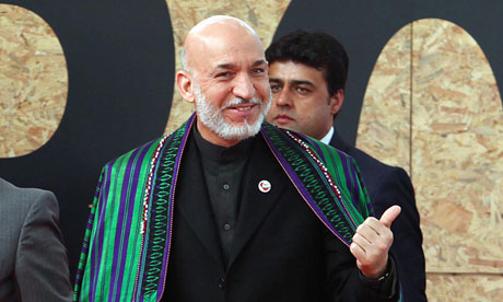 Hamid Karzai, the Afghan president, arrives for the Lisbon Nato  summit