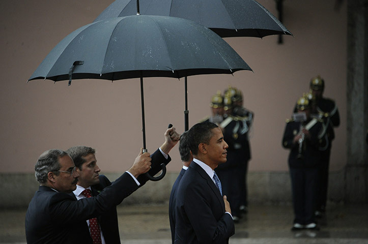 24 Hours: Barack Obama stands during a ceremony at the Presidential Palace in Lisbon