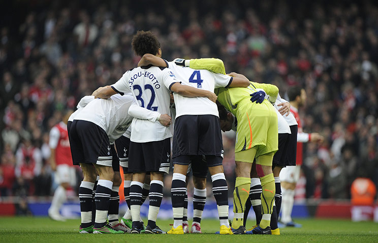 Arsenal v Spurs: Spurs players huddle before the kick-off against Arsenal