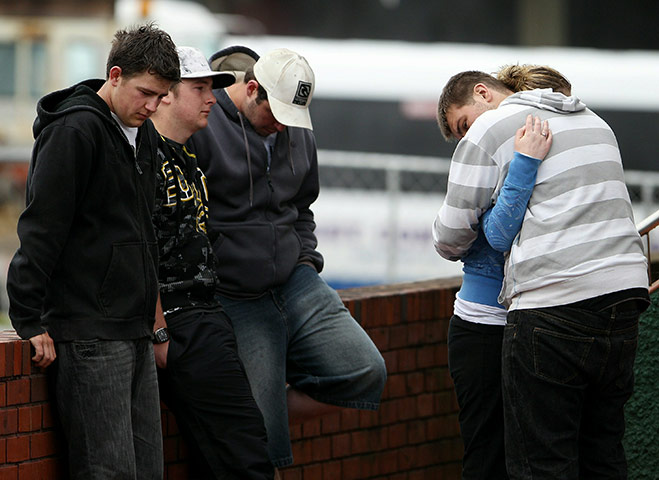 New Zealand mine: Worried friends and family stand outside the Red Cross Welfare Centre 