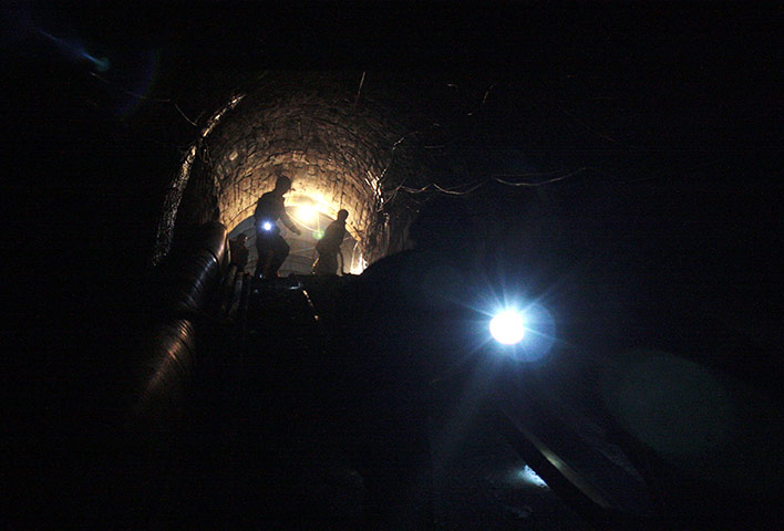 24 hours in pictures: 28 trapped miners in China