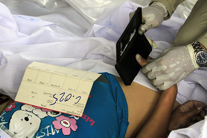 Cambodian stampeded: Cambodian police collect thumb prints stampede victims 