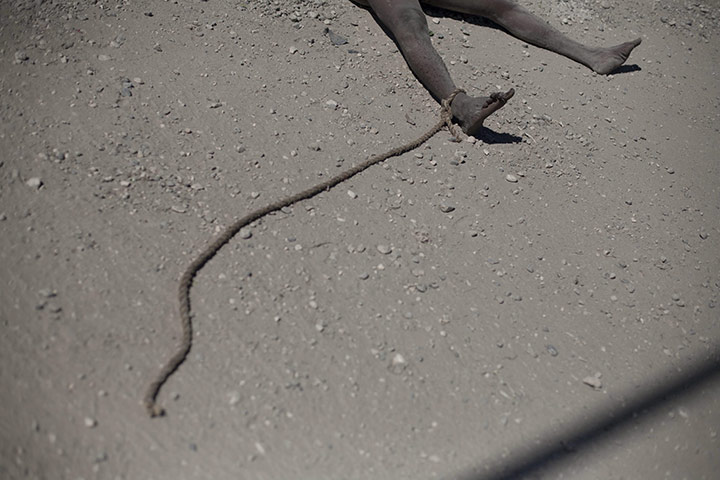 Haiti Cholera: BODY OF A NAKED MAN LAYS IN A PORT AU PRINCE STREET