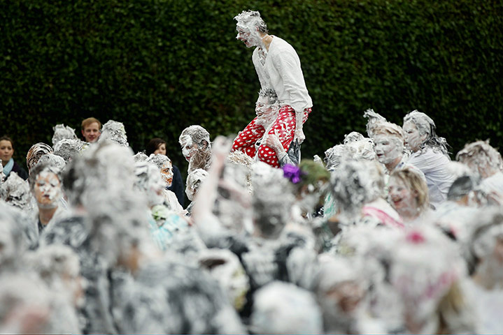 24 hours in pics: Students from St Andrews University covering themselves with foam