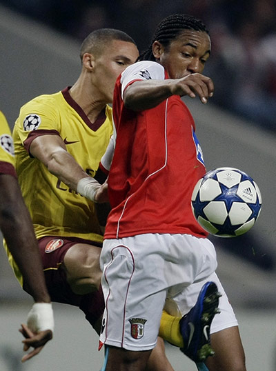 Champions League Tuesday: Sporting Braga's Alan battles for the ball with Arsenal's Gibbs 