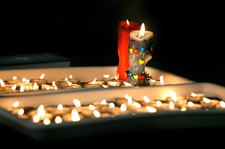 NZ miners: Burning candles at Holy Trinity Anglican Chruch during a candlelight vigil