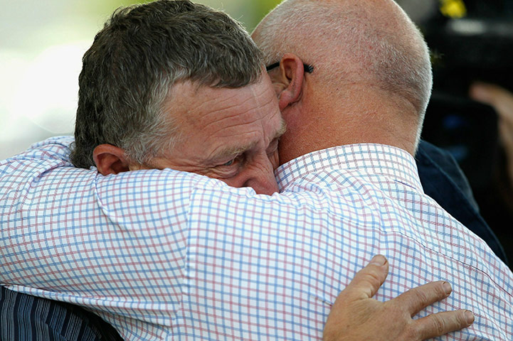NZ miners: Greymouth District Council Mayor Tony Kokshoorn is consoled by a friend